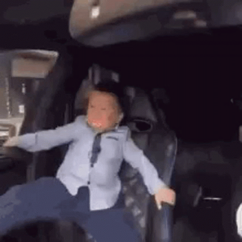 Crazy Driving Kid Holding On GIF