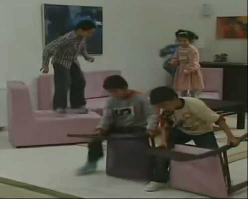 Crazy Kids Carrying Seats While Walking GIF