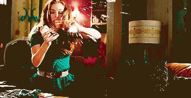 Happy Isla Fisher Holding Credit Card GIF