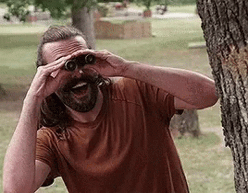 Creeper Behind Tree Using Binoculars GIF