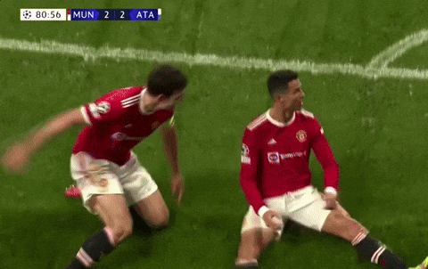 Cristiano Ronaldo Scoring A Goal Hugged By Teammates GIF