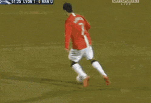 Cristiano Ronaldo Scoring A Goal Kicks Ball In Open Field GIF