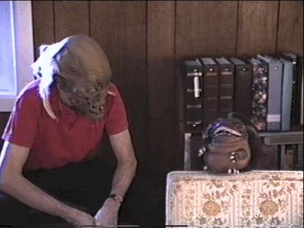 Critters Hiding Under Sofa GIF