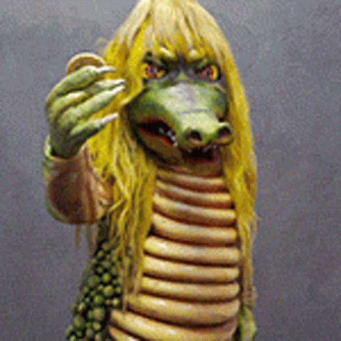 Crocodile Statue With Yellow Hair and Sharp Claws