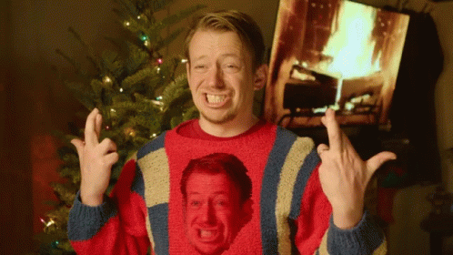 Cross Fingers Awkward Smile GIF
