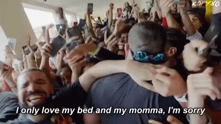 Crowd Around Man and Woman Hugging