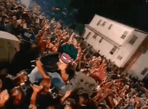 Crowd Around Stage With Masked Man GIF