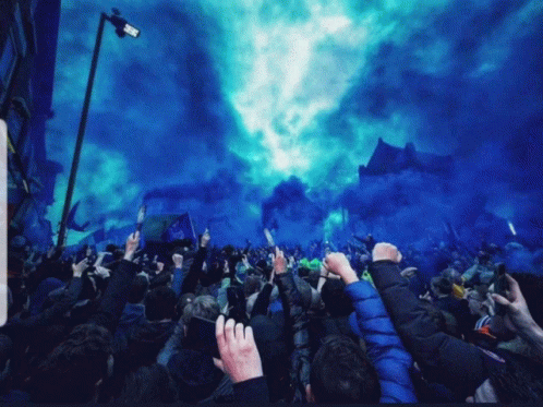 Crowd Fists Raised with Blue Smoke