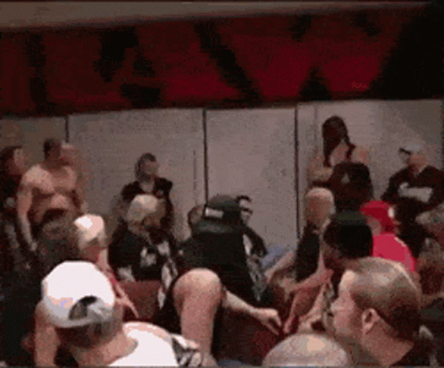 Crowd Gathered in Room With R&A Sign
