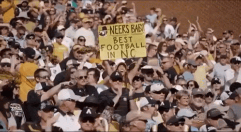 Crowd Holding Sign Saying Neers Baby