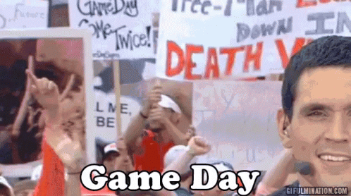 Crowd Holding Signs Saying Game Day