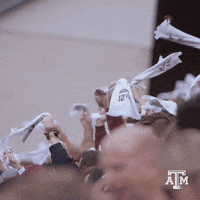 Crowd Holding White Shirts With ATM