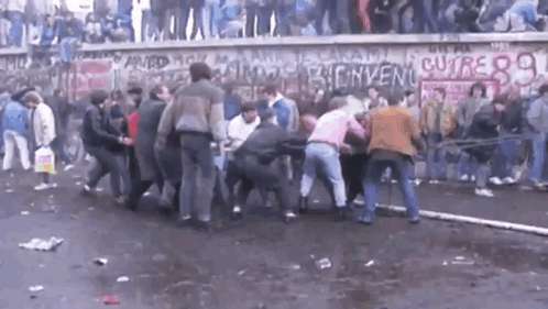 Crowd in Front of Wall With Bienvenue Written