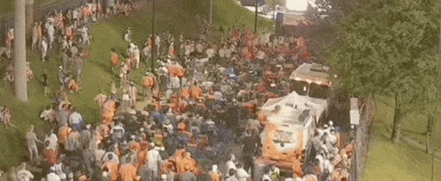 Crowd in Park Near Emergency Bus