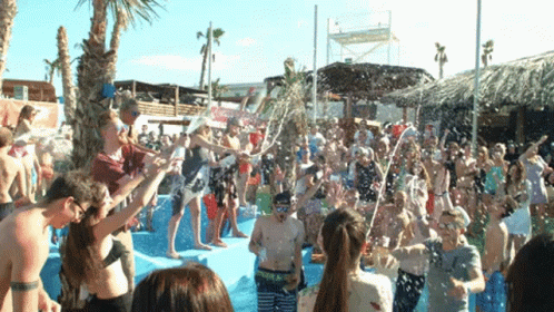 Crowd in Pool With Water Bottles Pouring