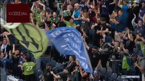 Crowd In Stadium With Goodal Banner GIF