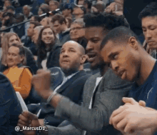 Crowd Sitting in Basketball Stands