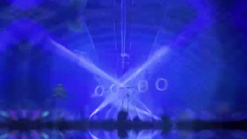 Crowd Watching Concert With Blue Lights GIF
