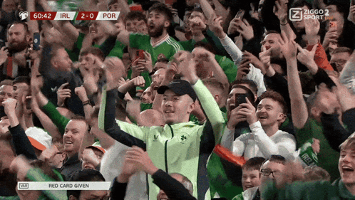 Crowd Watching Soccer Scoreboard Ireland 2-0 Por