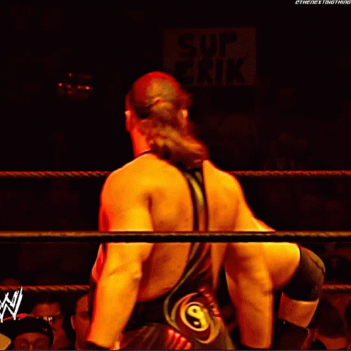 Crowd Watching Wrestling Match With US Army Sign