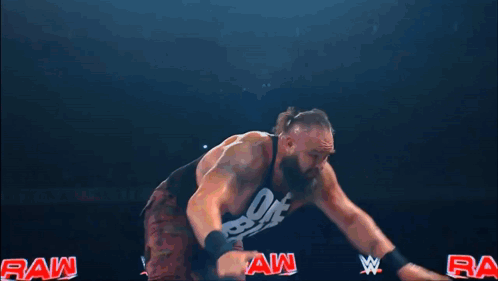 Crowd Watching Wrestling Match With WWE Shirt