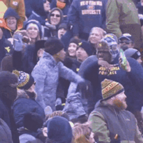 Crowd With Man in Best For Us University Shirt