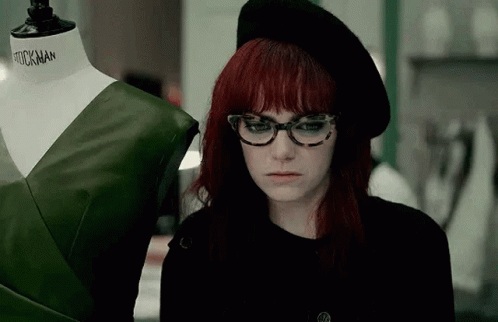 Shy Emma Stone Cruella Smile GIF