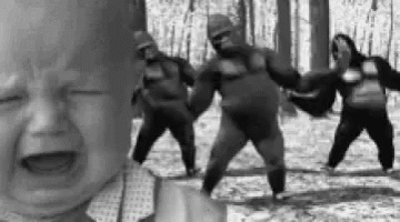 Crying Baby With Dancing Gorillas in Woods