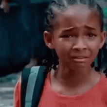 Crying Girl in Red Shirt With Backpack