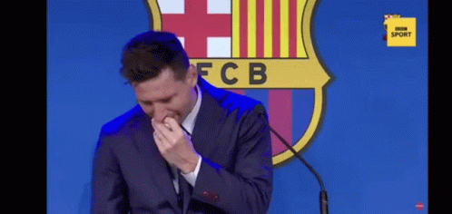 Crying Man in Suit at Microphone FC Barcelona Logo
