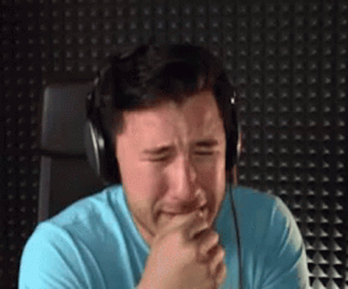 Crying Man with Blue Shirt and Headphones