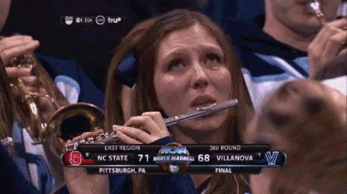 Crying Woman Playing Flute NCAA March Madness