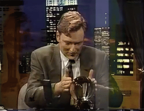 Conan O'brien Rubbing Crystal Ball GIF