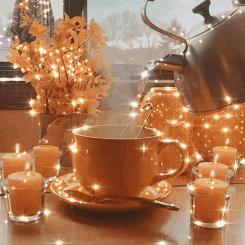 Cup Of Coffee With Spoon And Candles GIF