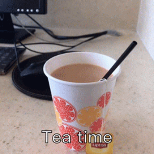 Cup Of Lipton Tea Next To Computer Monitor GIF