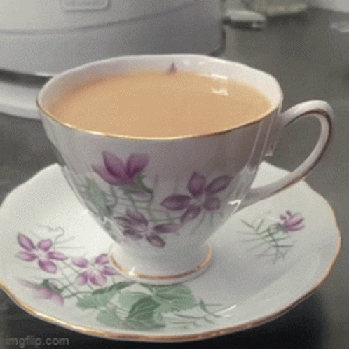 Cup of Tea on Saucer with Purple Flowers