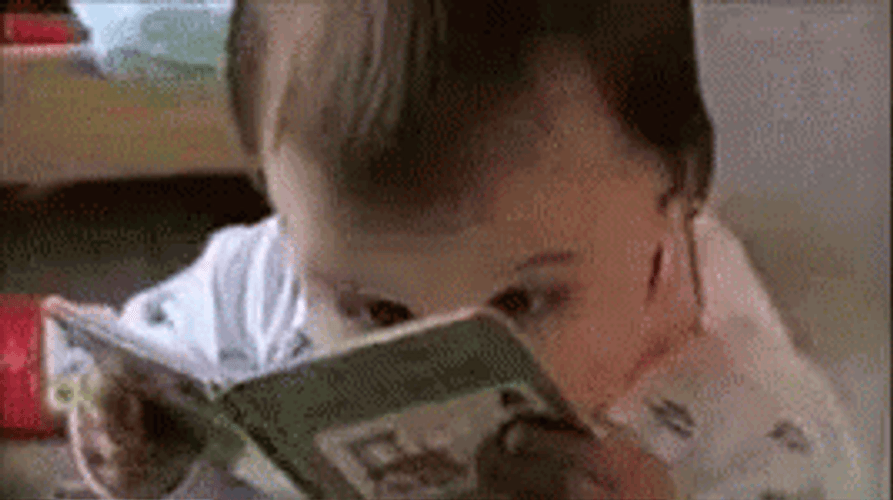 A baby cries after opening a book (funny) on Make a GIF