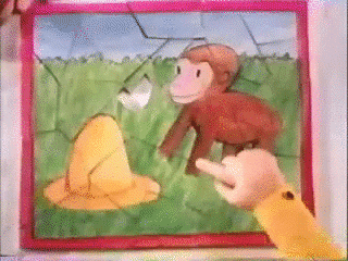 Curious George Pointing At Missing Puzzle Piece GIF