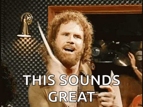 Curly Hair Beard Man Holding Drum Stick Saying This Sounds Great