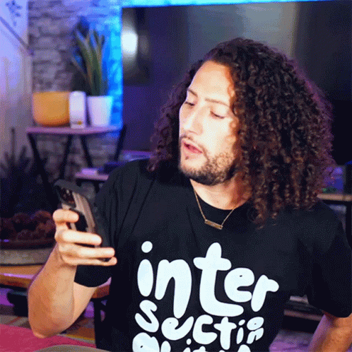 Curly Hair Man In Black Shirt Saying Inter Sectio GIF