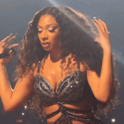 Curly Hair Woman Singing Into Microphone Black Bra