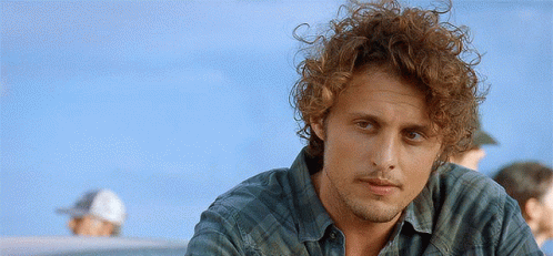 Curly Haired Bearded Man Green Plaid Shirt