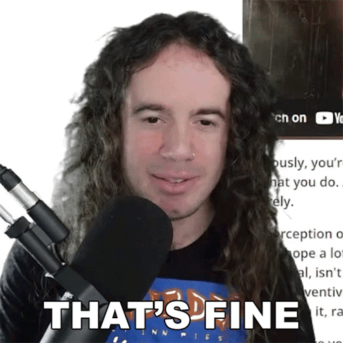 Curly Haired Man at Microphone Says That's Fine