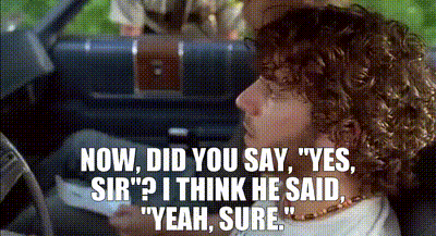 Curly Haired Man in Driver's Seat Talking