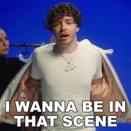 Curly Haired Man in White T-Shirt and Jacket Says I Wanna Be in That Scene