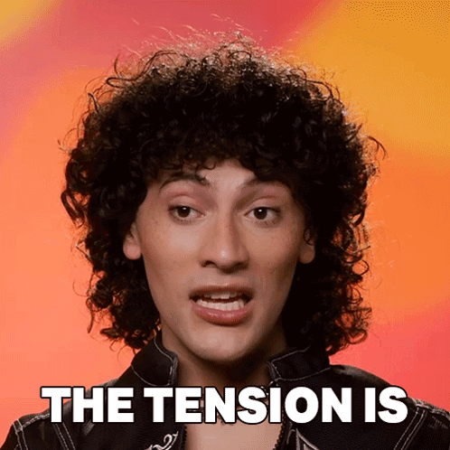 Curly Haired Man Saying The Tension Is