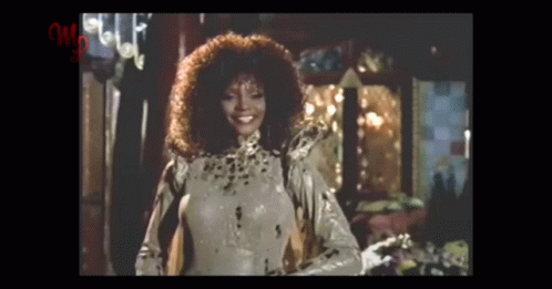 Curly Haired Woman In Leopard Print Costume GIF
