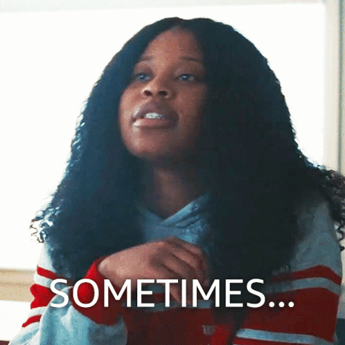 Curly Haired Woman Saying Sometimes In Striped Shirt GIF