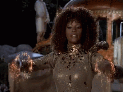 Curly Haired Woman With Arms Outstretched By Carriage GIF