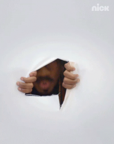 Curly Man Peeking Through The Teared Sheets GIF